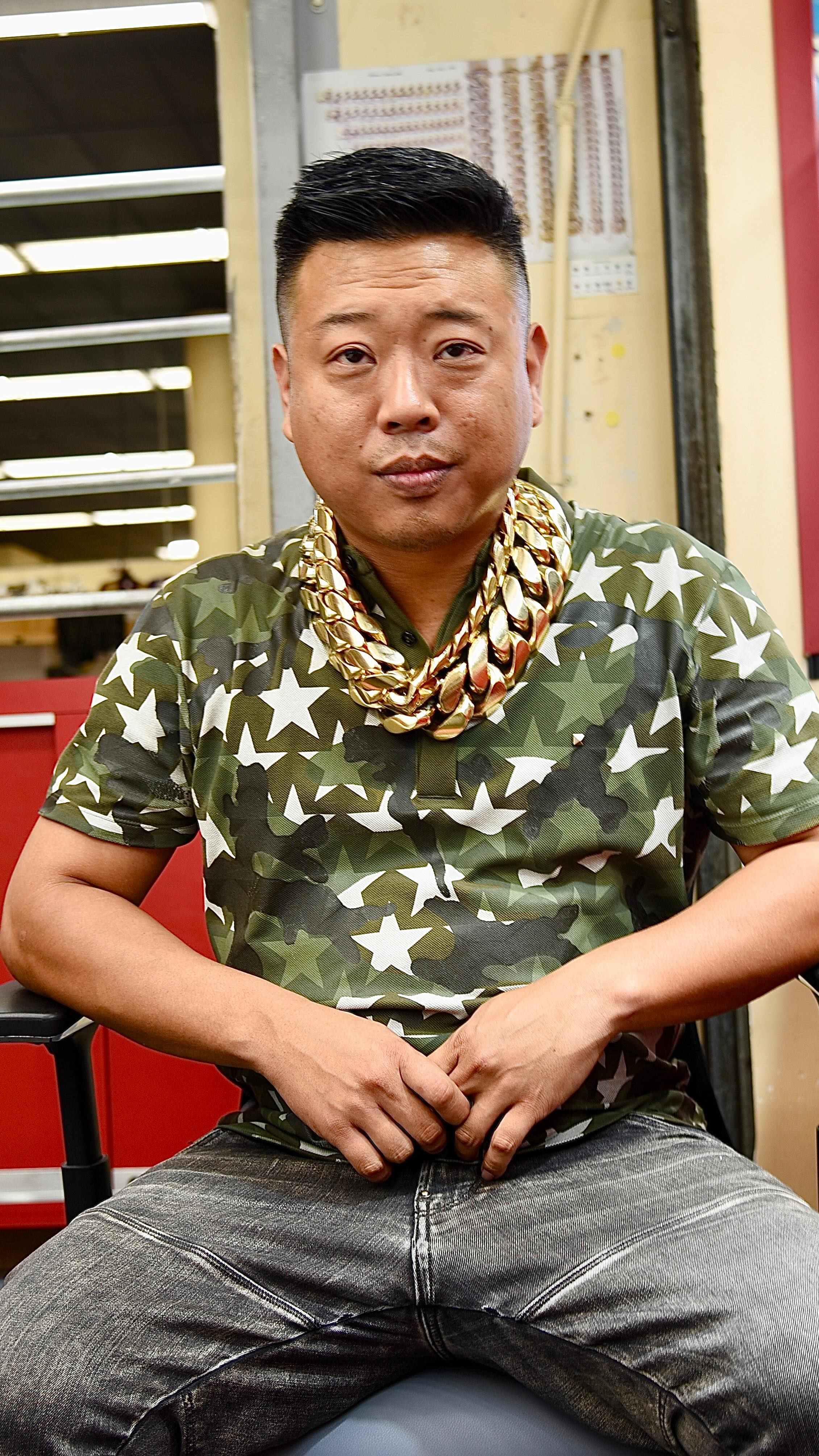 Franky Diamonds at his jewelry store, wearing his signature chains